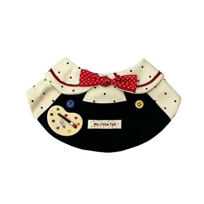 Artist-themed pet neckwear with red polka-dot bow, palette motif and contrasting buttons