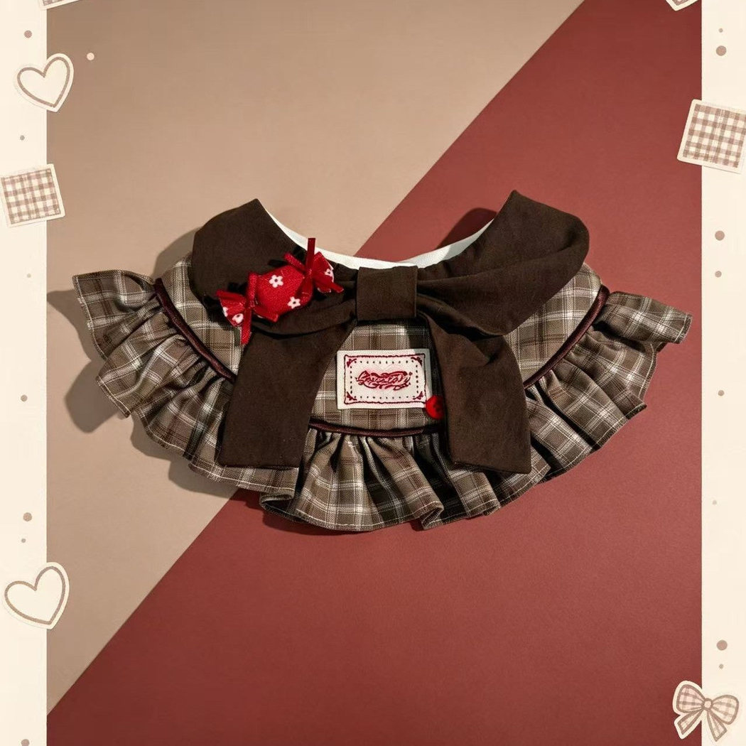 Brown plaid pet neckwear with layered ruffles, oversized bow and red candy ornament
