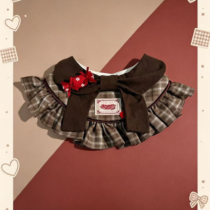 Brown plaid pet neckwear with layered ruffles, oversized bow and red candy ornament
