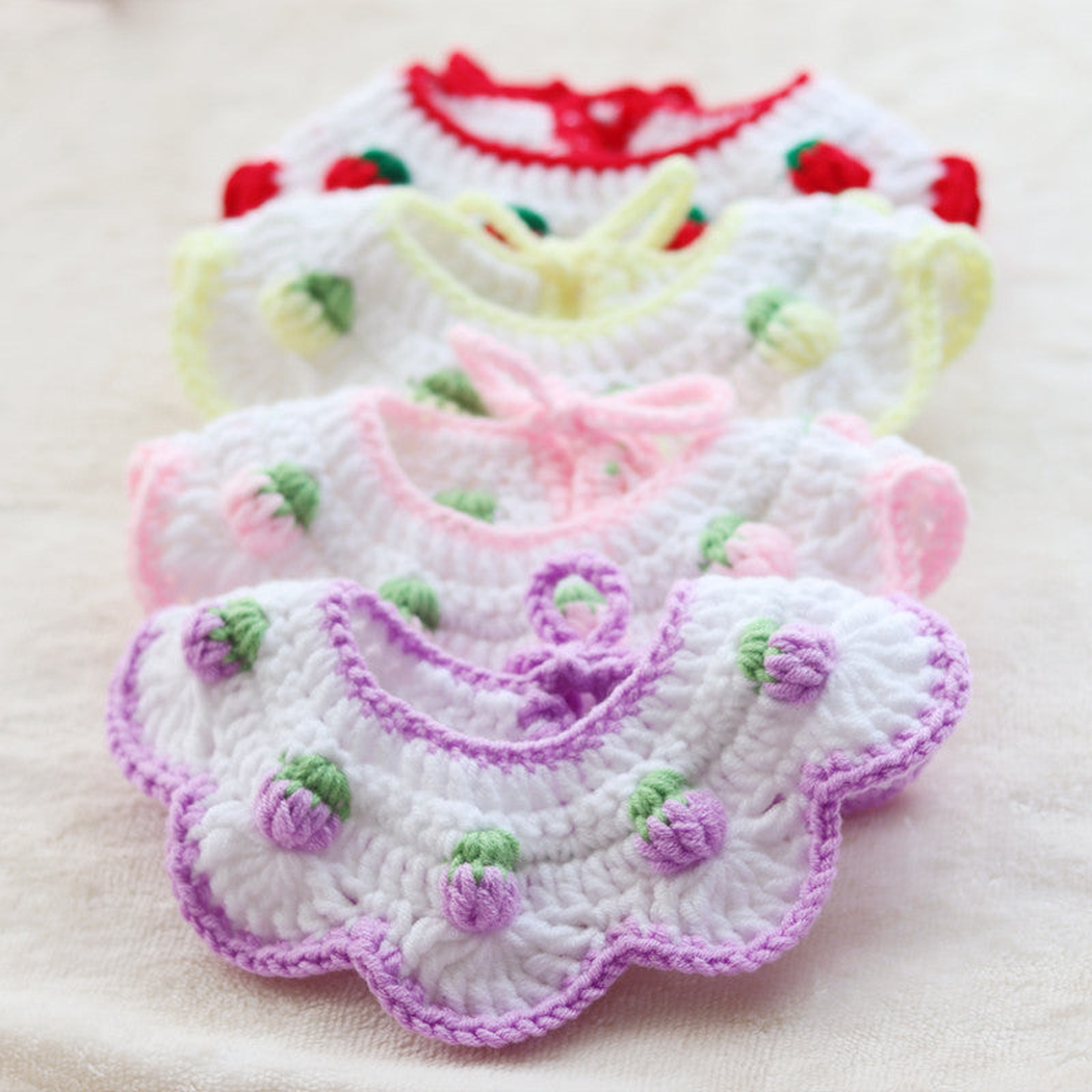 Four pet neckwear styles layered to show their scalloped fronts and raised bud motifs