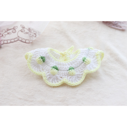 Pink Bud pet neckwear laid open to show the full scalloped shape, neck opening and tie cords
