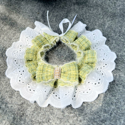 Green plaid bow pet neckwear with white lace-look ruffle, top view