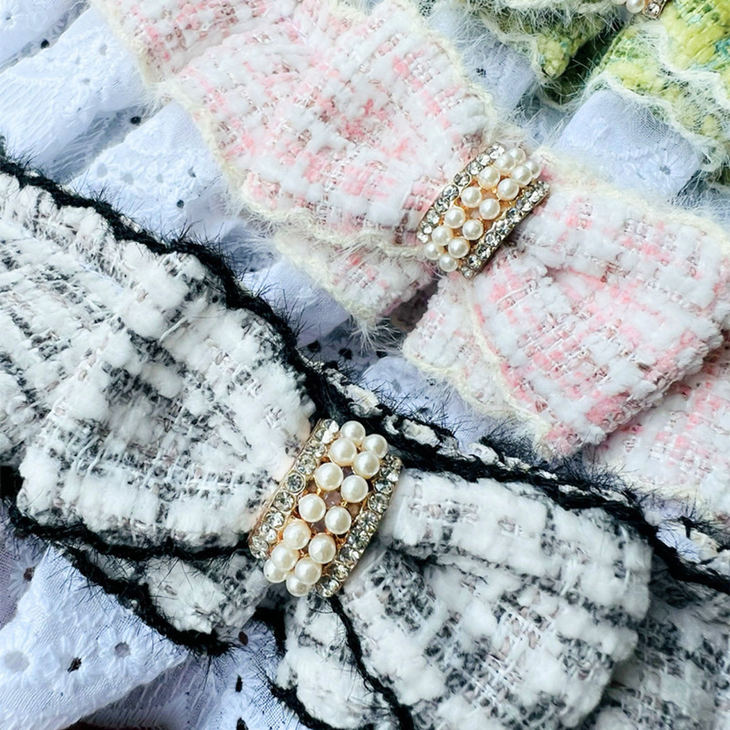 Close-up of Light Pink and Multicolor plaid bows with pearl-look center bands