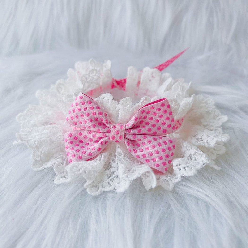 Pink Dots pet neckwear with a polka-dot bow and white ruffled lace-look edge