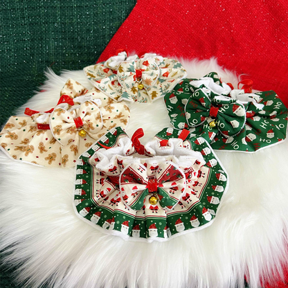 Four printed pet neckwear styles arranged together with bows and bells
