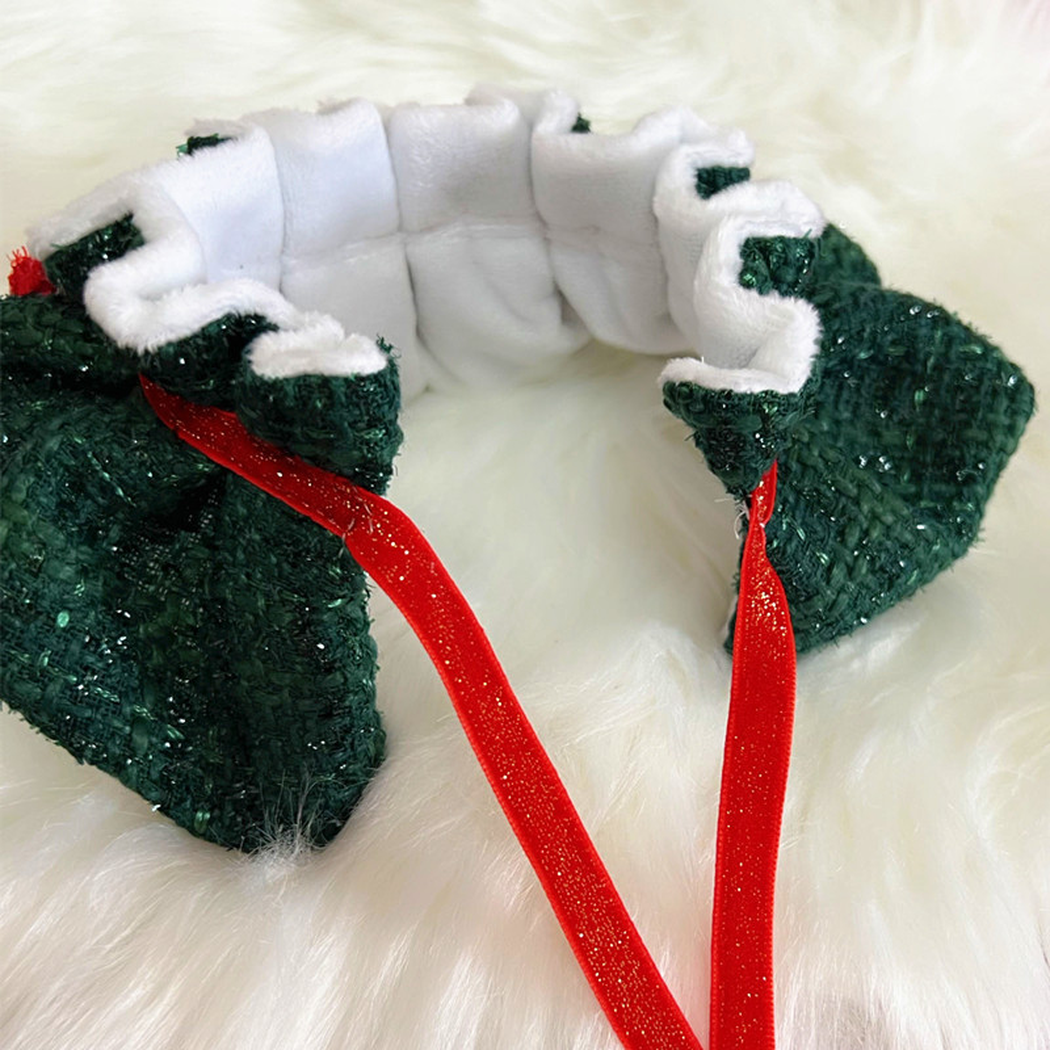 Close-up of the ruffled interior and red tie straps on green pet neckwear