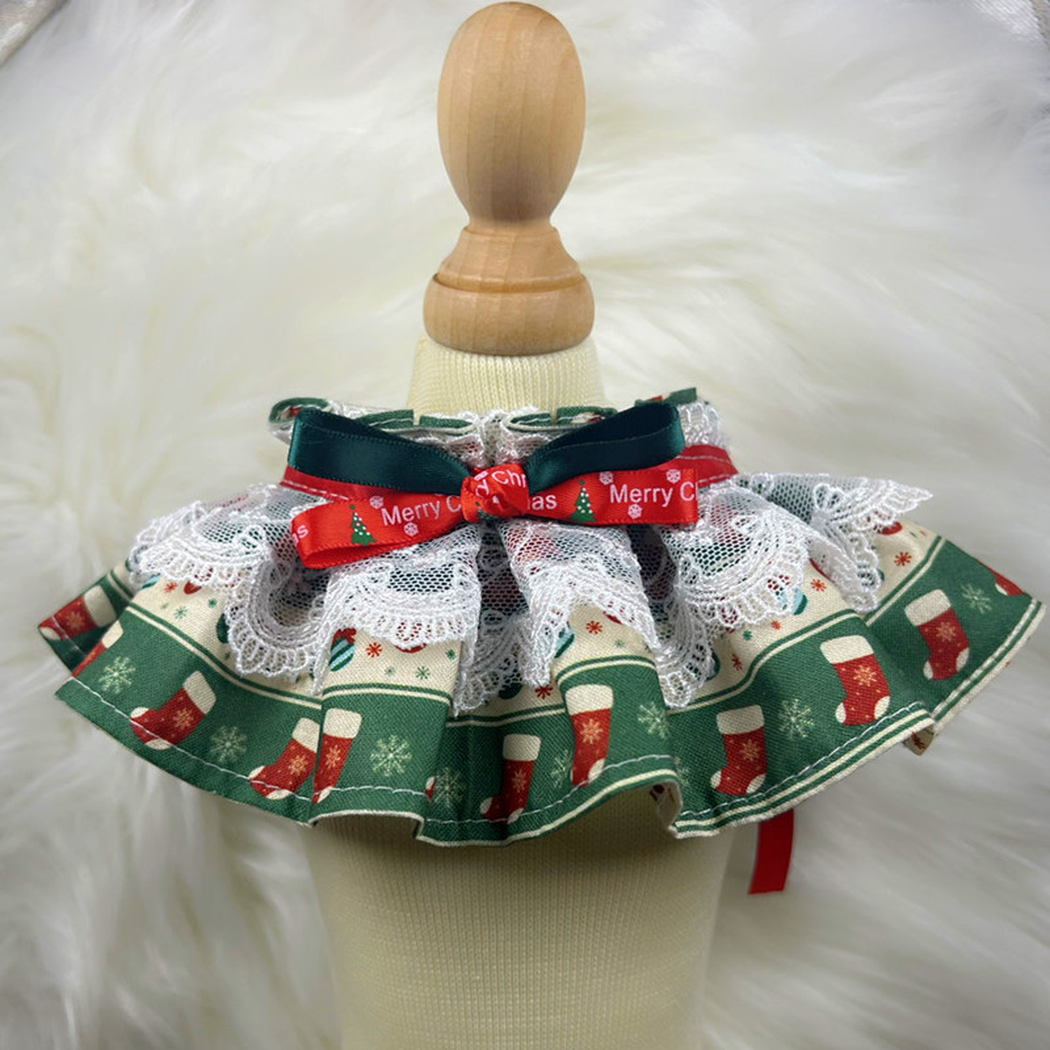 Stockings cat neckwear displayed on a stand with layered lace and ribbon bow