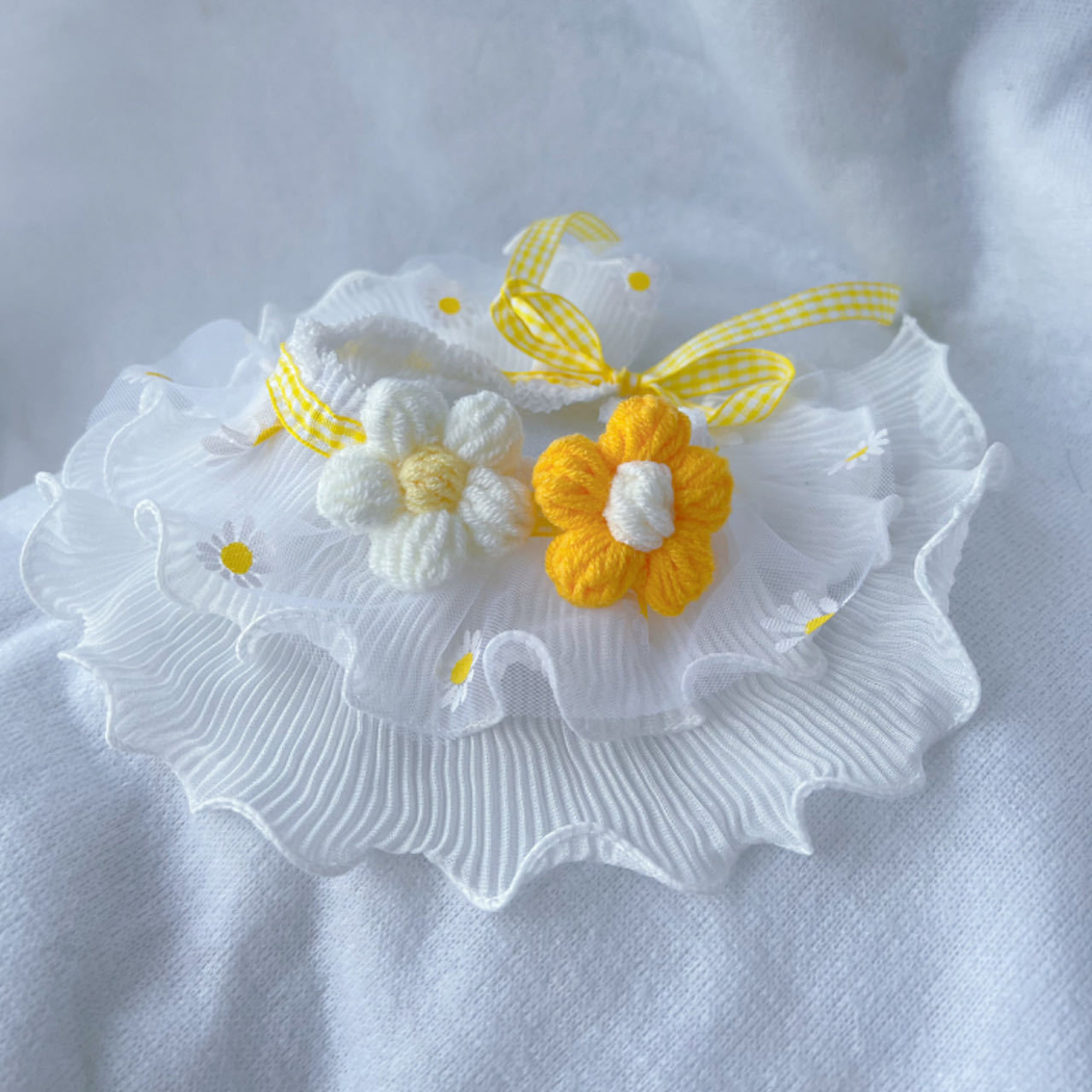 Yellow daisy-print ruffled pet neckwear with flower appliqués and gingham ties