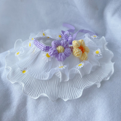 Purple daisy-print ruffled pet neckwear with purple and pale yellow flower appliqués