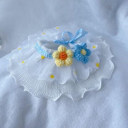 Blue daisy-print ruffled pet neckwear with yellow and blue flower appliqués