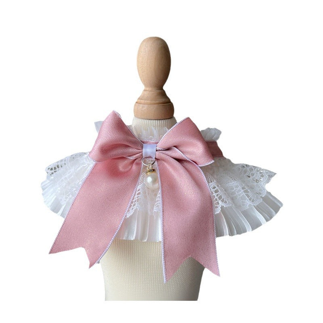 Pink bow pet neckwear with white ruffles on a plain white background