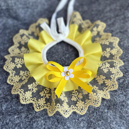 Yellow ruffled pet neckwear with a floral lace-look edge and bow