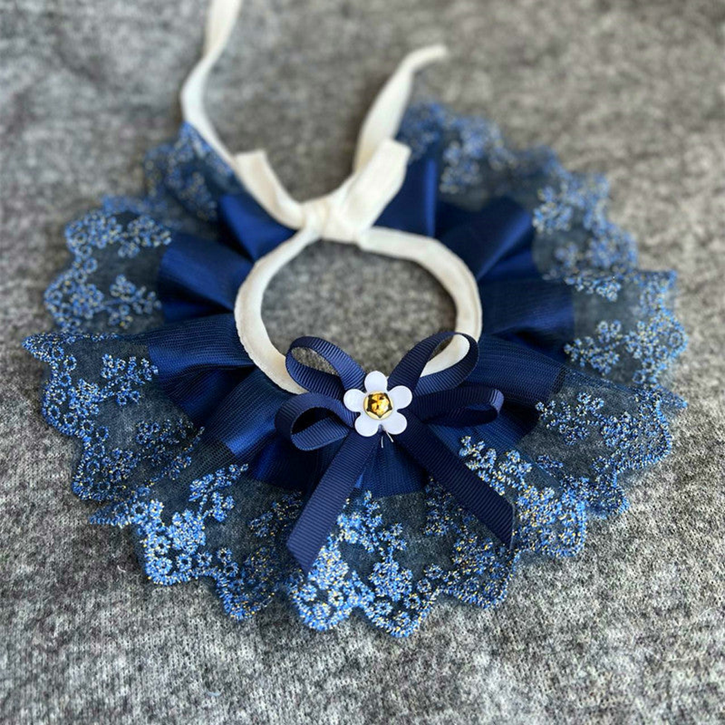 Navy ruffled pet neckwear with a floral lace-look edge and bow