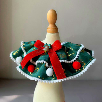 Snowflakes pet neckwear in green with a red bow and pom-pom trim