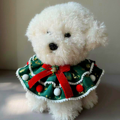Dog wearing green Snowflakes pet neckwear with a red bow and layered trim