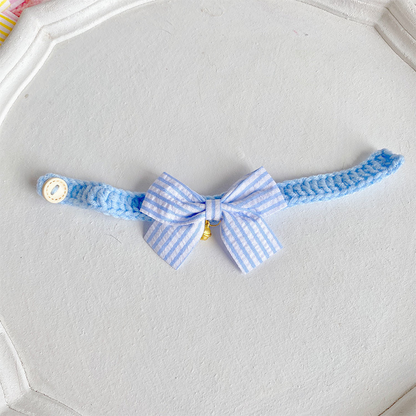 Blue cat collar with striped bow and gold-tone bell