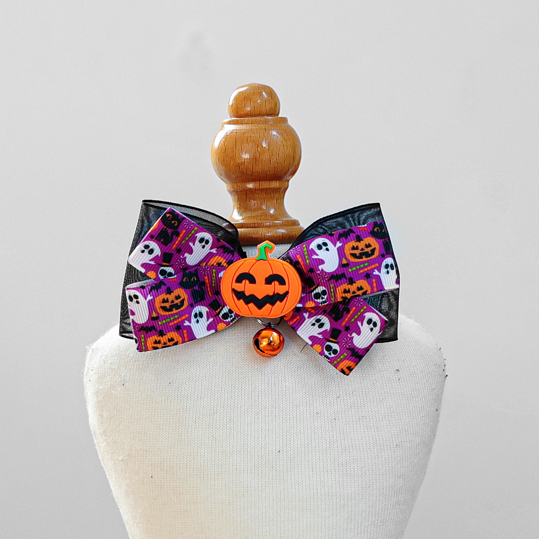 Purple ghost-and-pumpkin bow pet neckwear with orange pumpkin accent and bell