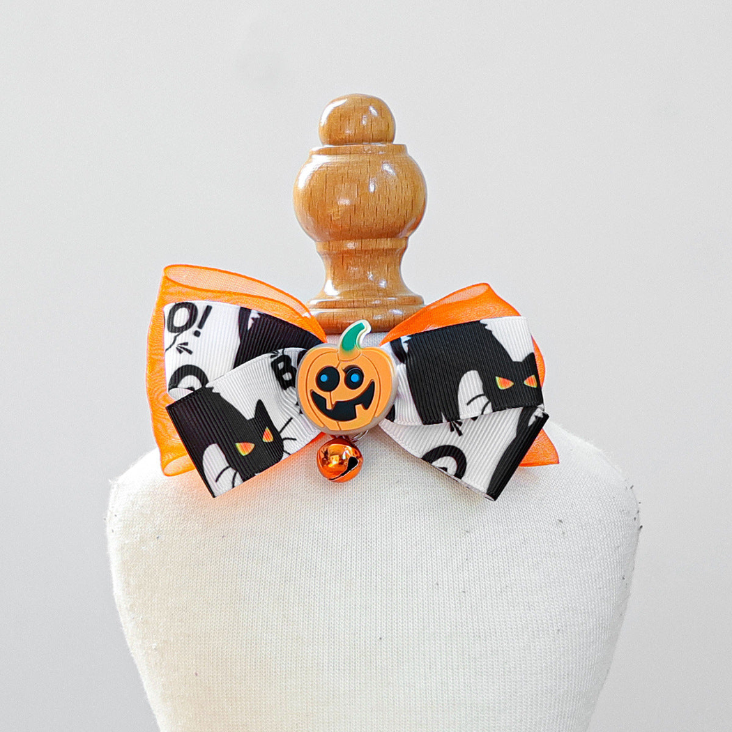 Black-and-white cat-print bow pet neckwear with orange pumpkin accent and bell