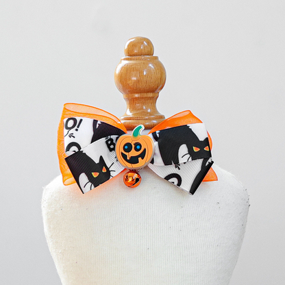 Black-and-white cat-print bow pet neckwear with orange pumpkin accent and bell