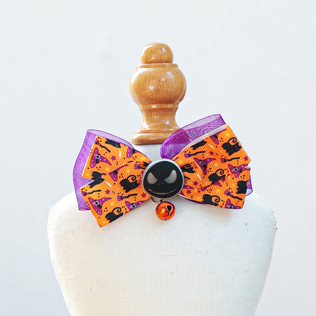 Orange and purple printed bow pet neckwear with black face accent and orange bell