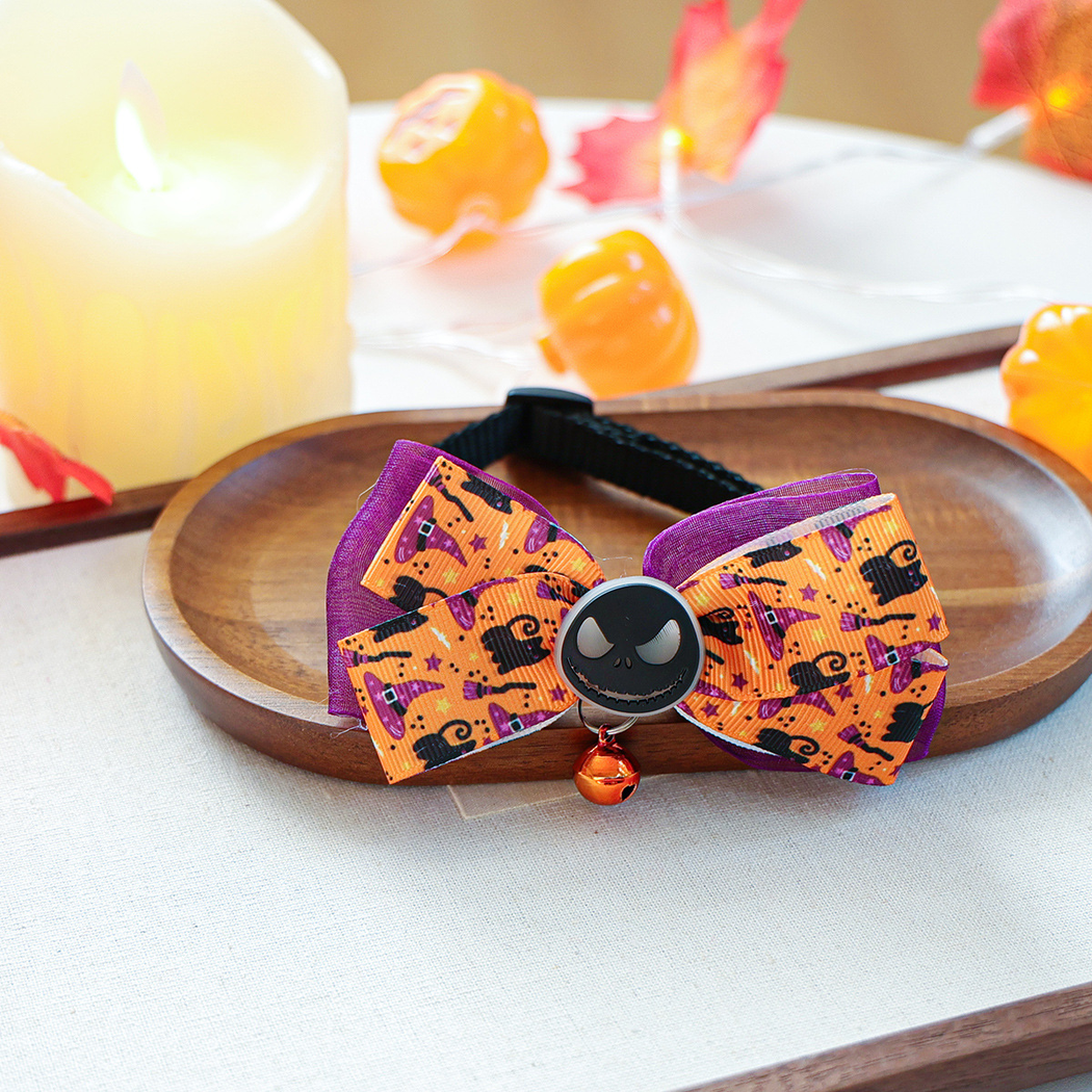 Orange and purple printed bow pet neckwear arranged with an adjustable black neck strap