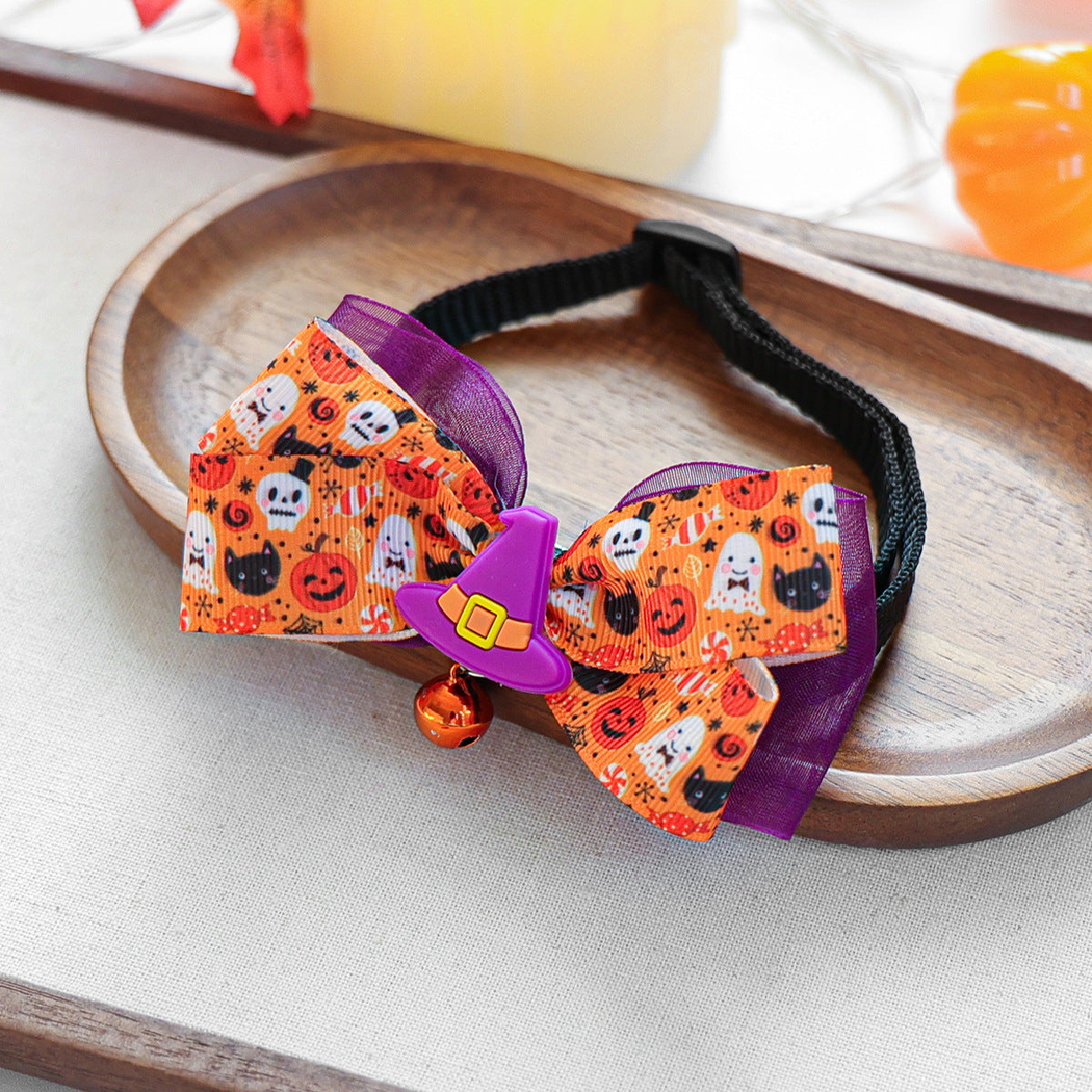 Witch Hat pet neckwear bow with orange motifs, purple ribbon and bell
