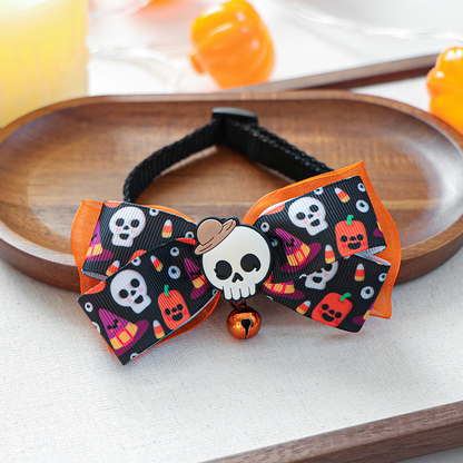 Hooded Skull pet neckwear bow with pumpkin motifs, orange ribbon and bell