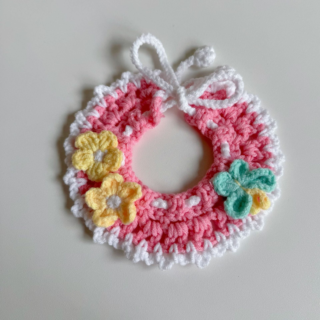 Pink openwork pet neckwear with yellow flowers and butterfly appliqué