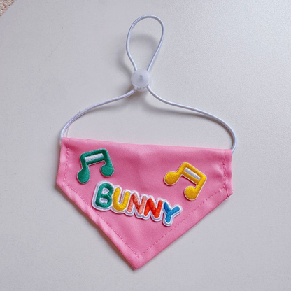 Bunny pet neckwear with multicolor lettering and musical-note appliqués