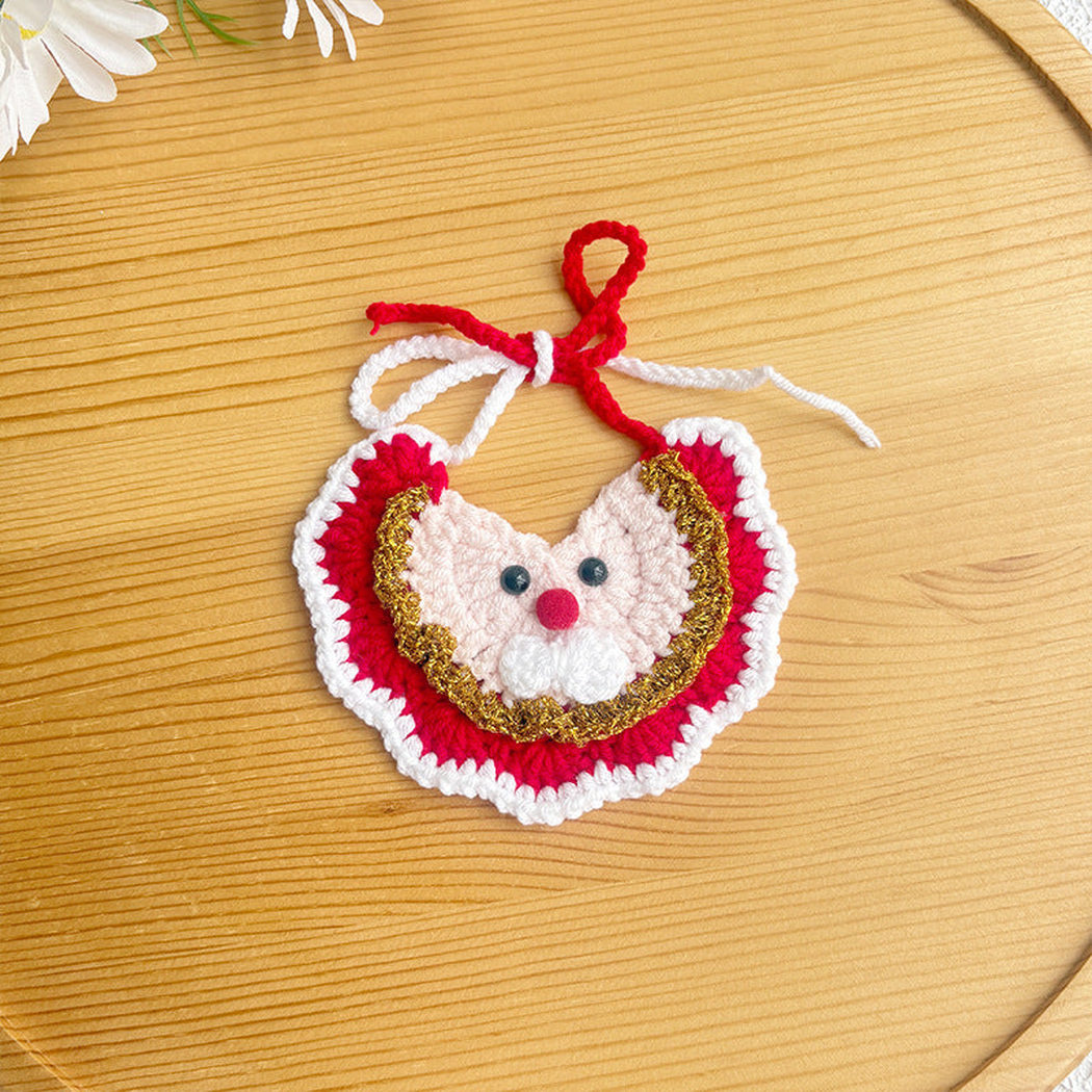 Red Santa-face bib-style pet neckwear with gold-tone trim and white scalloped edging
