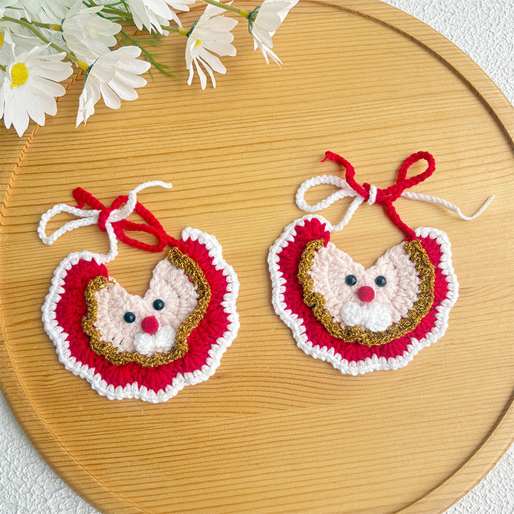 Two red Santa-face bib-style pet neckwear pieces with gold-tone trim