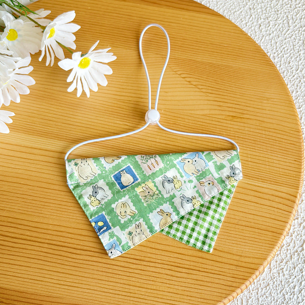 Green rabbit-pattern pet neckwear with gingham accent and white cord loop