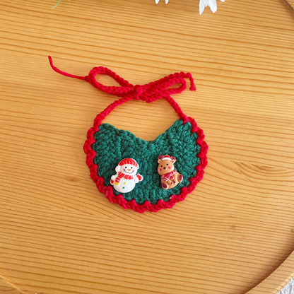 Snowman style green pet neckwear with red trim, snowman and reindeer accents