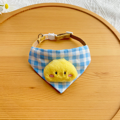 Chick style blue checked pet neckwear with yellow plush appliqué, front view