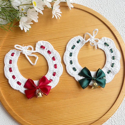 Two white pet neckwear styles with contrasting bows and bells
