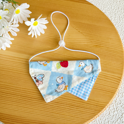 Strawberry Duck pet neckwear with blue checked accent and adjustable cord loop