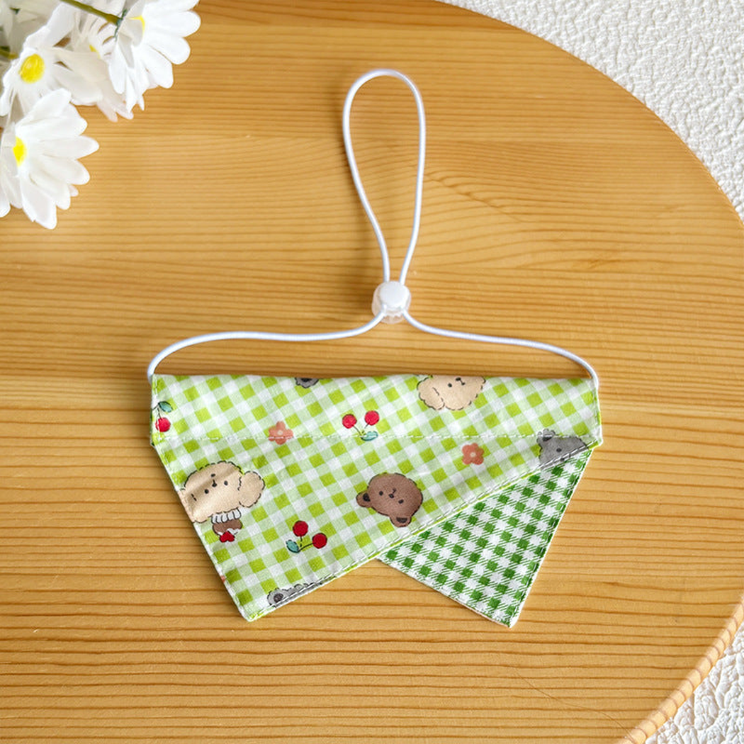 Green check pet neckwear with overlapping pointed panels and adjustable cord