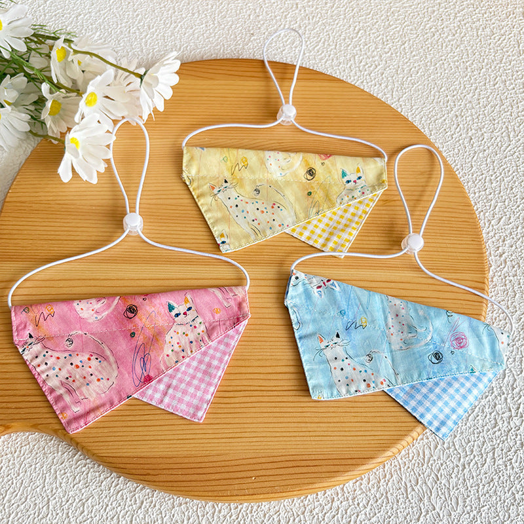 Pink, light blue and yellow doodle cat pet neckwear displayed together