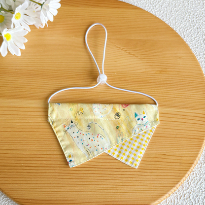 Yellow doodle cat pet neckwear with gingham accent and white neck loop