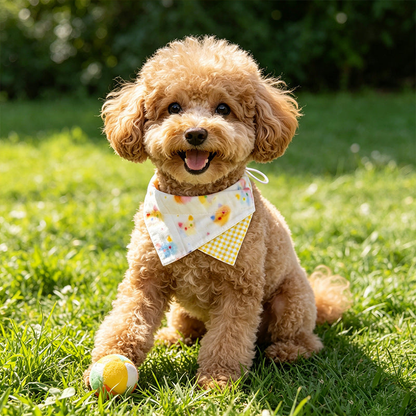 Curly-coated dog wearing colorful pet neckwear with a yellow gingham accent outdoors