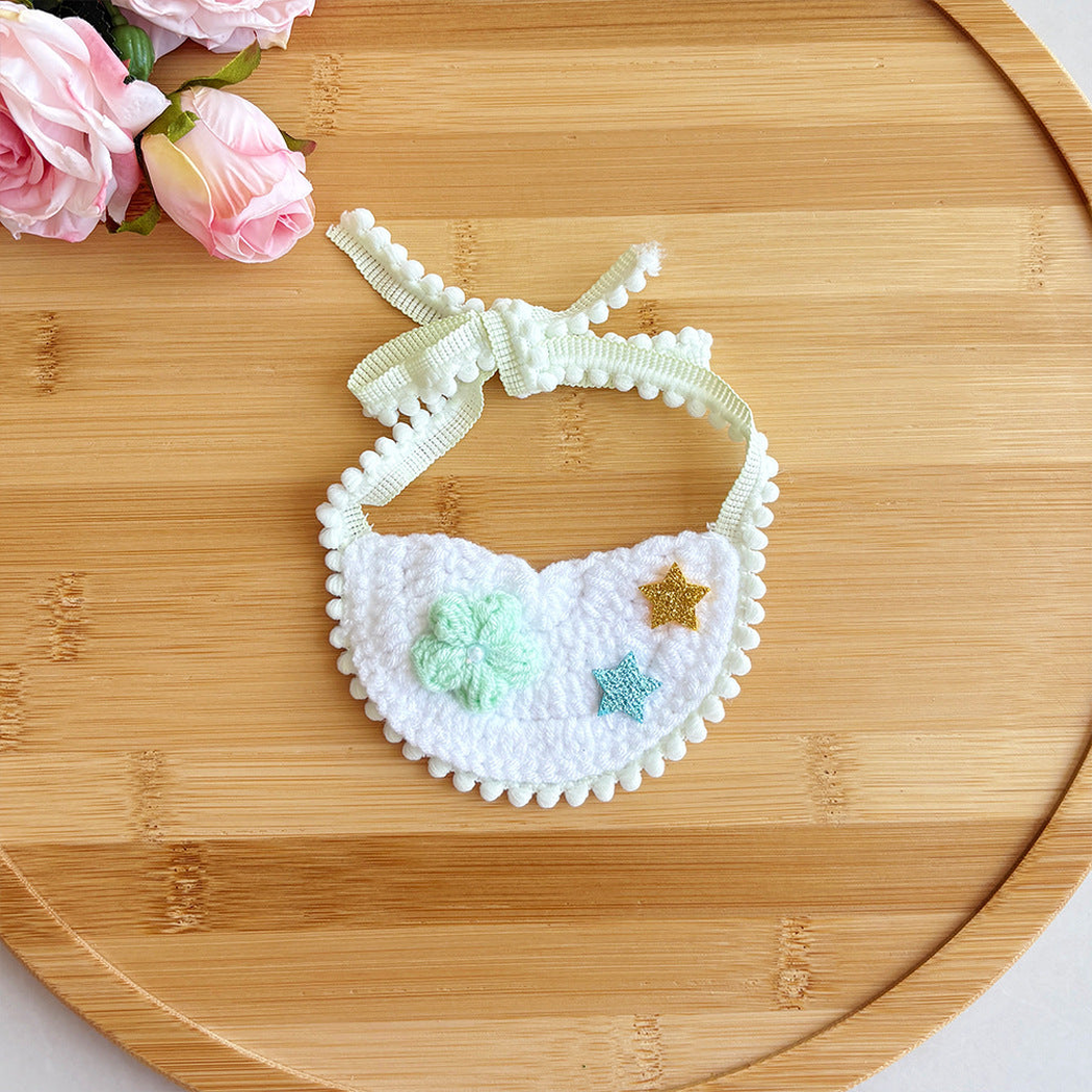 Mint pet neckwear with flower and star accents, flat view