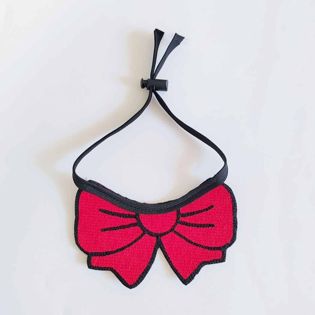 Red bow cat neckwear with black tie cord and sliding cord lock