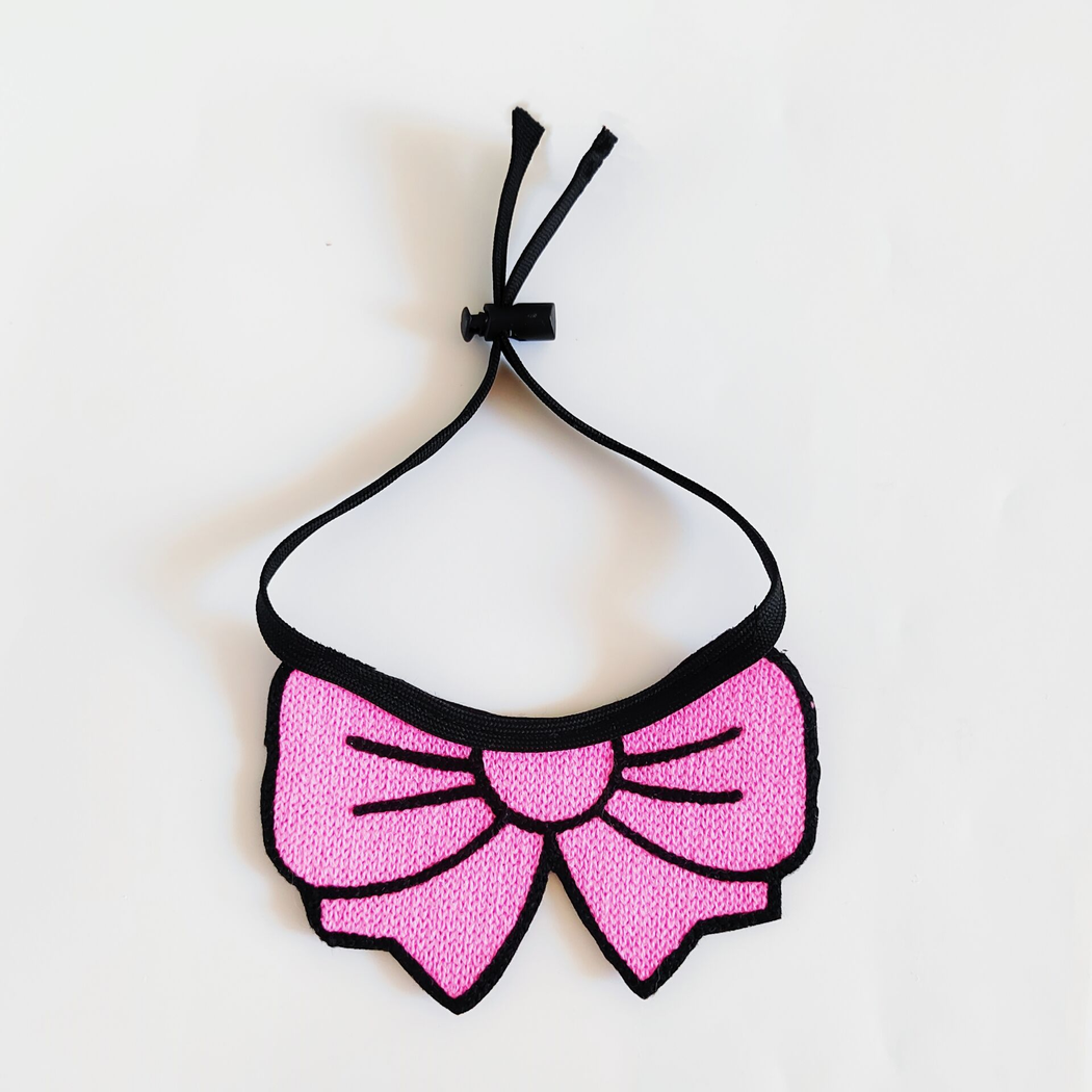 Pink bow cat neckwear with black tie cord and sliding cord lock