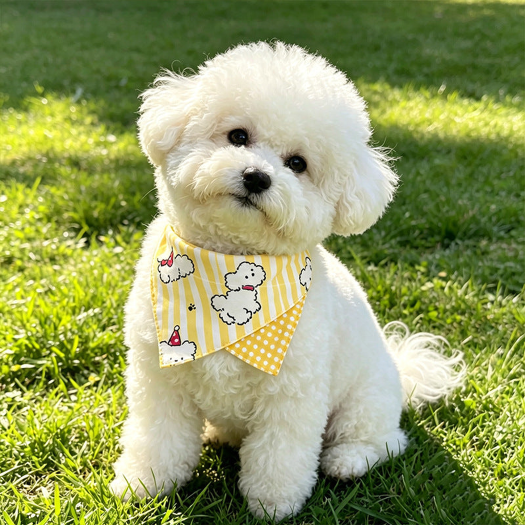 White dog wearing yellow dog-print pet neckwear outdoors