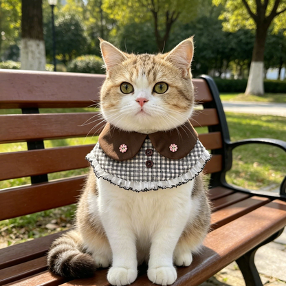Brown plaid cat neckwear with flower accents worn outdoors