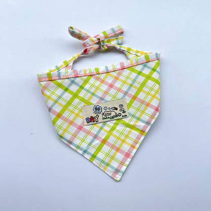 Green / Yellow plaid pet neckwear with tied straps and a rectangular cartoon patch.