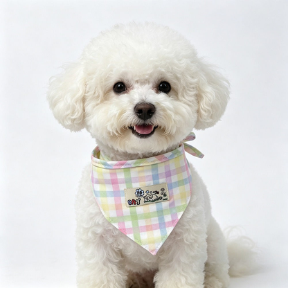 White dog wearing Mint / Purple checked pet neckwear with a cartoon patch.
