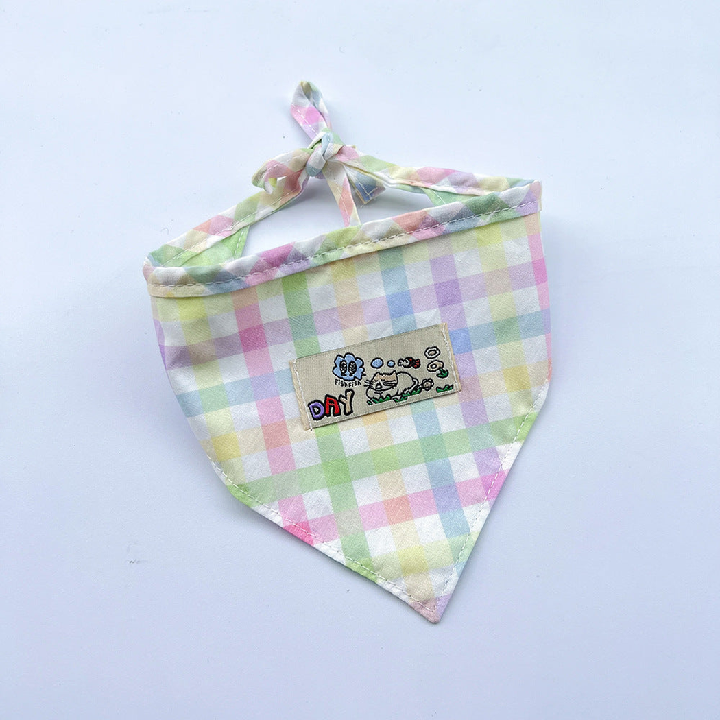 Mint / Purple checked pet neckwear with tied straps and a rectangular cartoon patch.