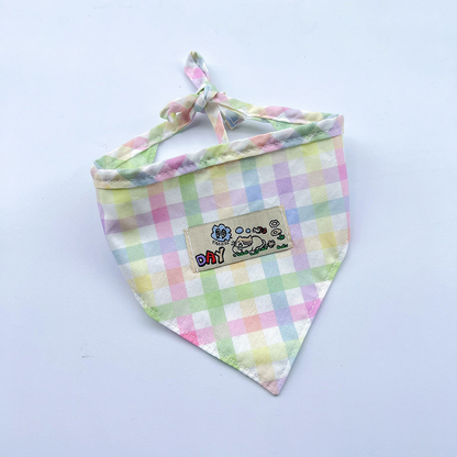 Mint / Purple checked pet neckwear with tied straps and a rectangular cartoon patch.