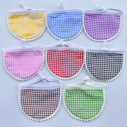 Gingham Pet Neckwear in eight colors with semicircular panels, white ties and pom-pom edging.